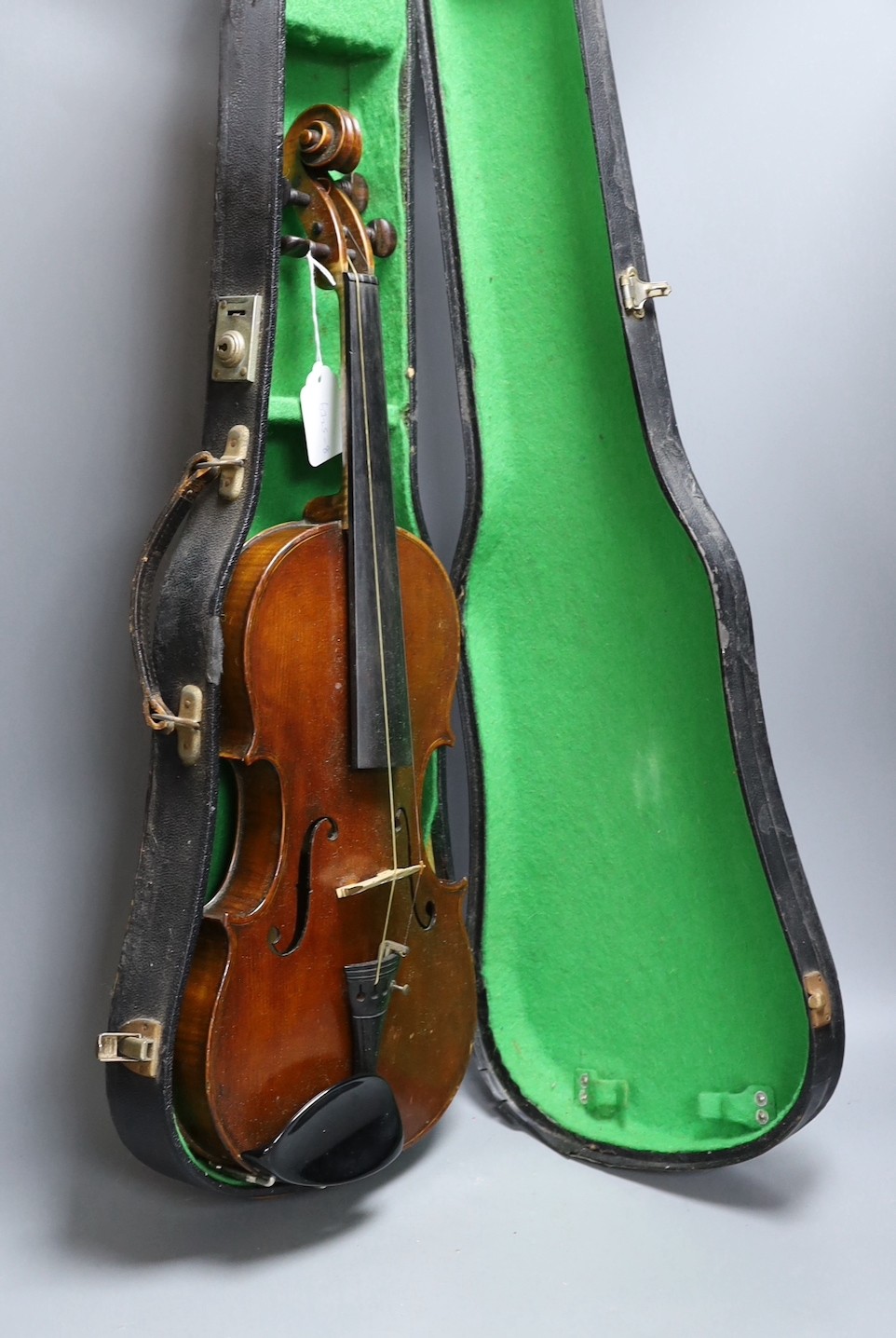 A cased late 19th century English violin, inscribed W. Heaton maker 1887 (?), back measures 35.5cm excl button